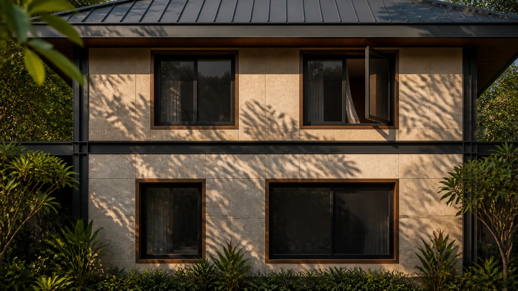 West wall carries tree shadows across pale panels and dark frames